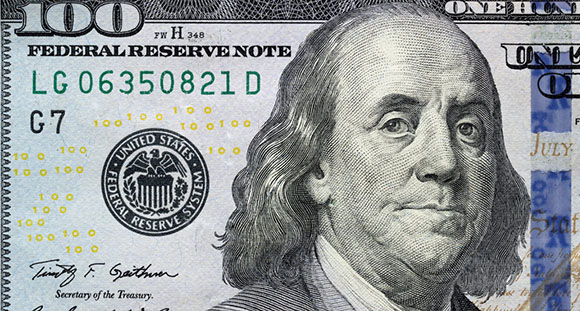a closeup of Benjamin Franklin on the one hundred dollar bank note